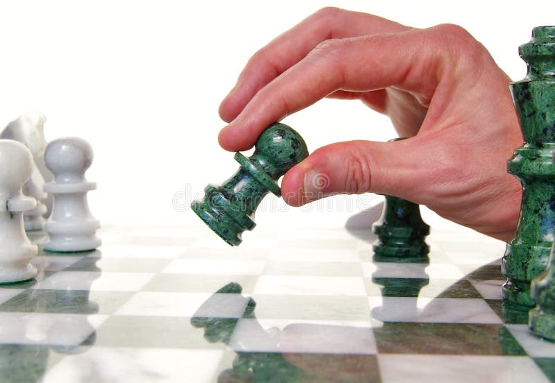 Player moving a chess piece across the board. Player moving a chess piece across the board