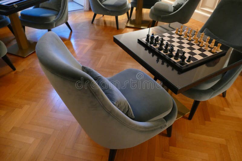 LECCE, ITALY - APR 6, 2019 - Chess table in a luxury hotel study, La Fiermontina Hotel, Lecce, Puglia, Italy. LECCE, ITALY - APR 6, 2019 - Chess table in a luxury hotel study, La Fiermontina Hotel, Lecce, Puglia, Italy