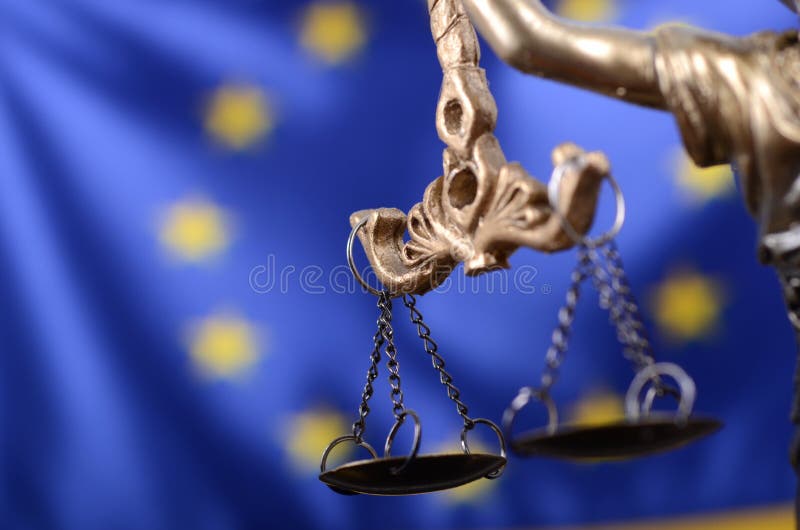 Law and Justice, Legality concept, Scales of Justice, Justitia, Lady Justice in front of the European Union flag in the background. Law and Justice, Legality concept, Scales of Justice, Justitia, Lady Justice in front of the European Union flag in the background.