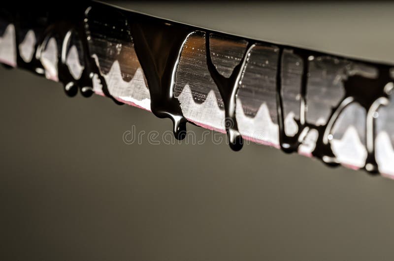 Sharp Katana Sword Blade Dripping Black Color Painting. Sharp Katana Sword Blade Dripping Black Color Painting