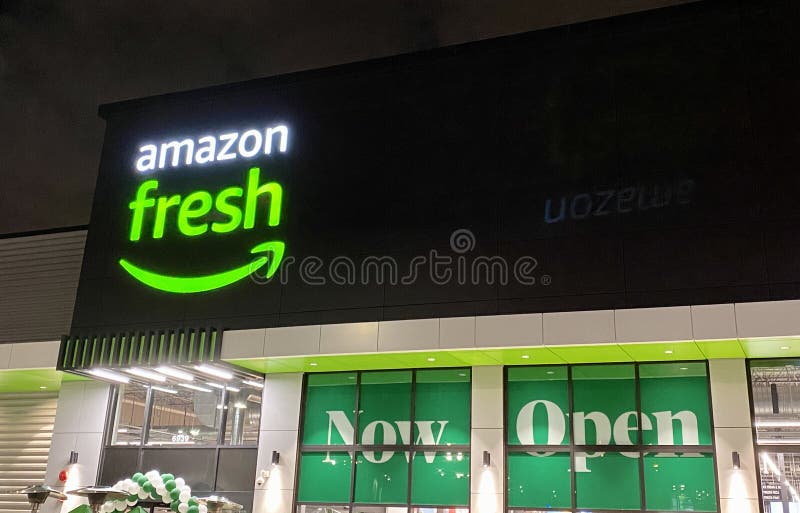 The storefront of the new Amazon Fresh store at night in Morton Grove, United States. The storefront of the new Amazon Fresh store at night in Morton Grove, United States