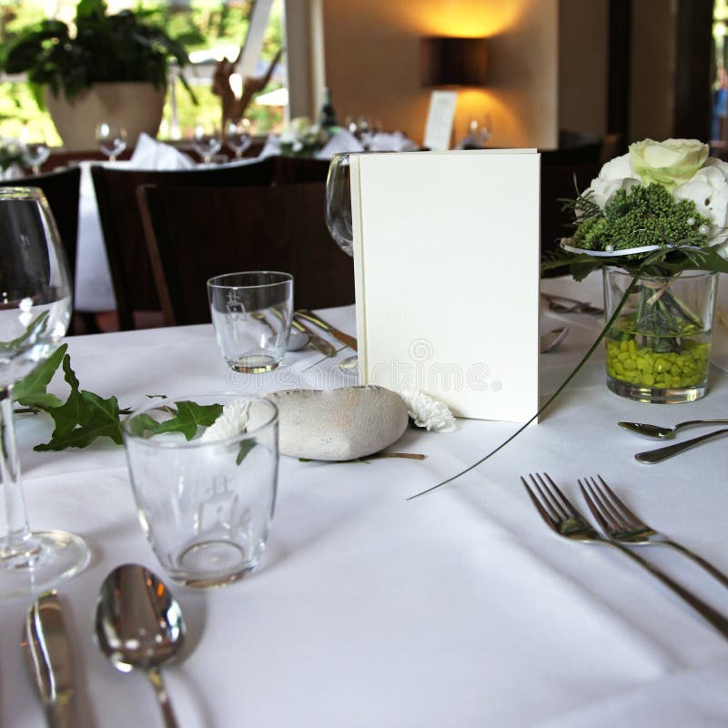Menu card on an elegantly set table in the restaurant. Menu card on an elegantly set table in the restaurant