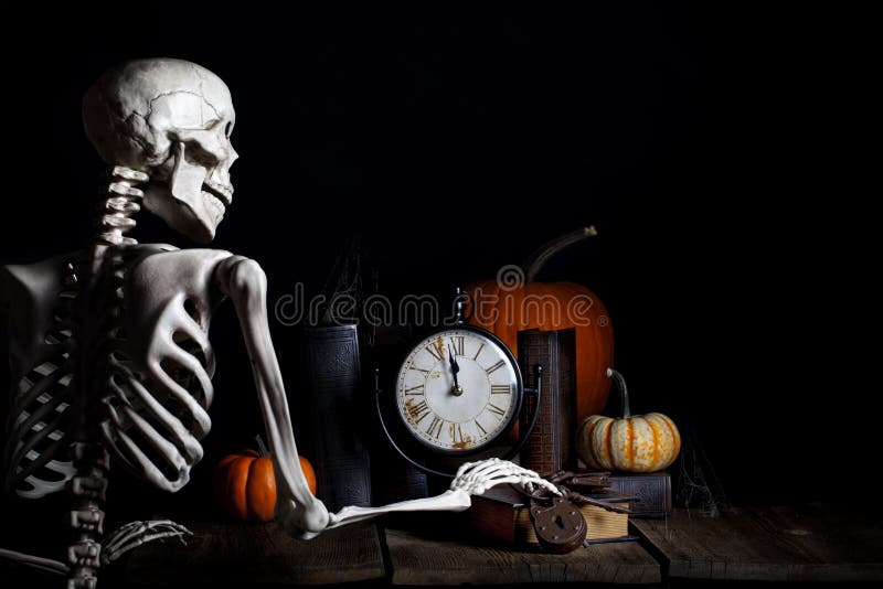 A skeleton checking the time and reaching for old iron keys, clock is about to strike midnight and he is on his way to haunt for Halloween. A skeleton checking the time and reaching for old iron keys, clock is about to strike midnight and he is on his way to haunt for Halloween.