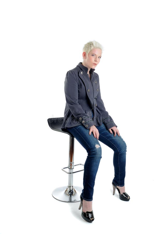Short Blond Haired Woman Sat On A Bar Stool. Short Blond Haired Woman Sat On A Bar Stool