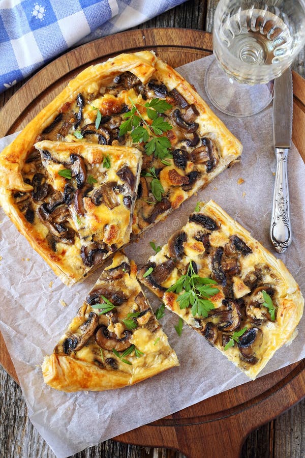 Mushroom tart and glass of white wine. Mushroom tart and glass of white wine