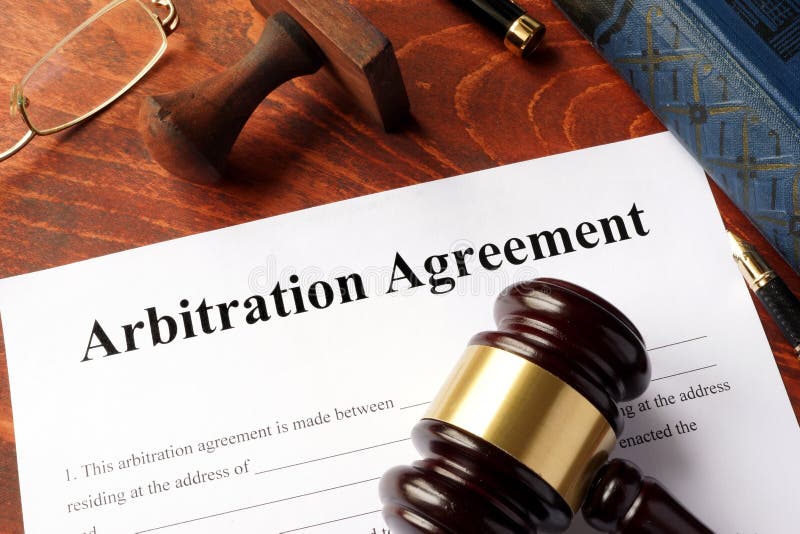 Arbitration agreement form on an office table. Arbitration agreement form on an office table.