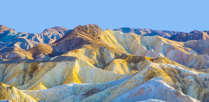 Picturesque soft waves from multi-coloured sandstone. Death valley, Zabriski - a point on a sunset. Picturesque soft waves from multi-coloured sandstone. Death valley, Zabriski - a point on a sunset