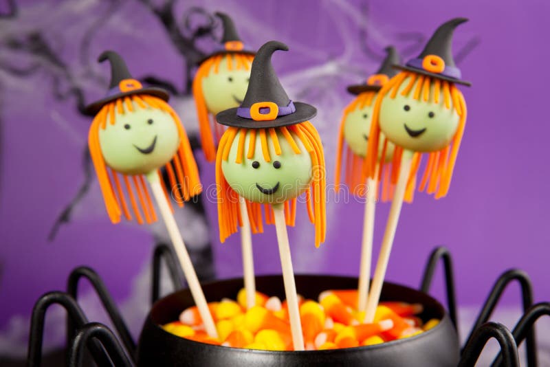 Witch cake pops. Round-shaped mini cakes dipped in chocolate and decorated with fondant. Witch cake pops. Round-shaped mini cakes dipped in chocolate and decorated with fondant