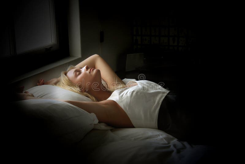 Portrait of a beautiful woman laying on the bed. Portrait of a beautiful woman laying on the bed