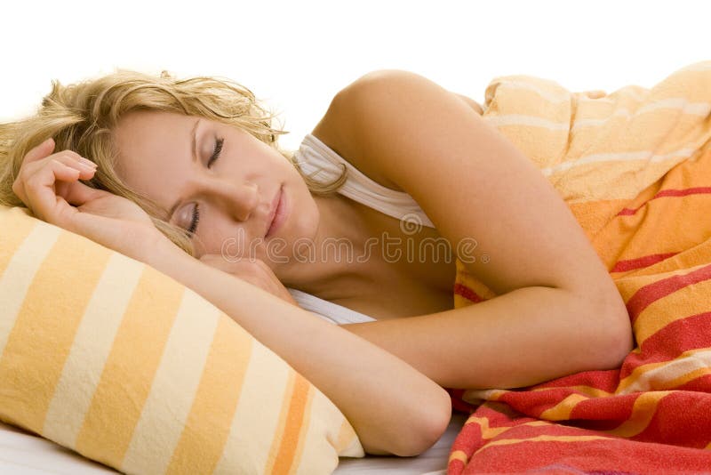 Young blonde woman sleeping in her bed. Young blonde woman sleeping in her bed