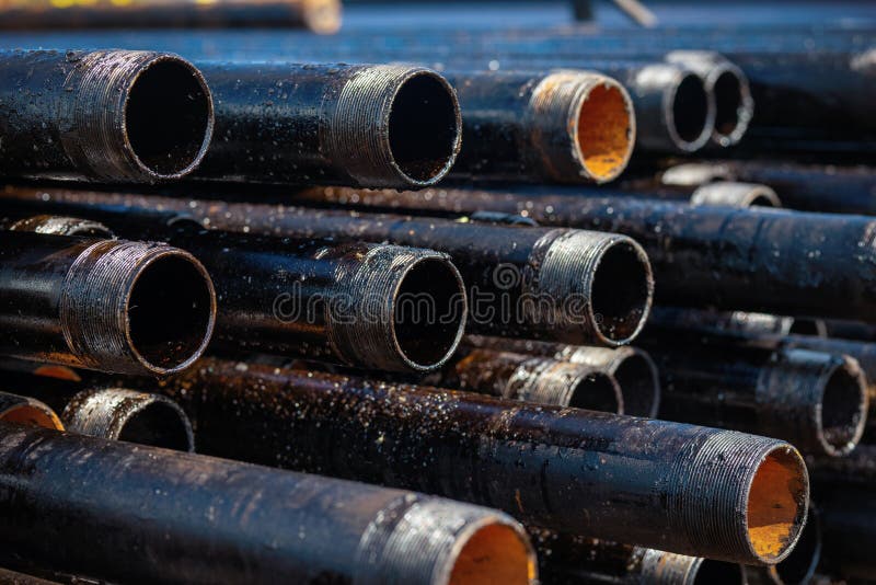 Close up drill pipe thread with pipe dope grease lay down on rig floor at oil and gas. Close up drill pipe thread with pipe dope grease lay down on rig floor at oil and gas