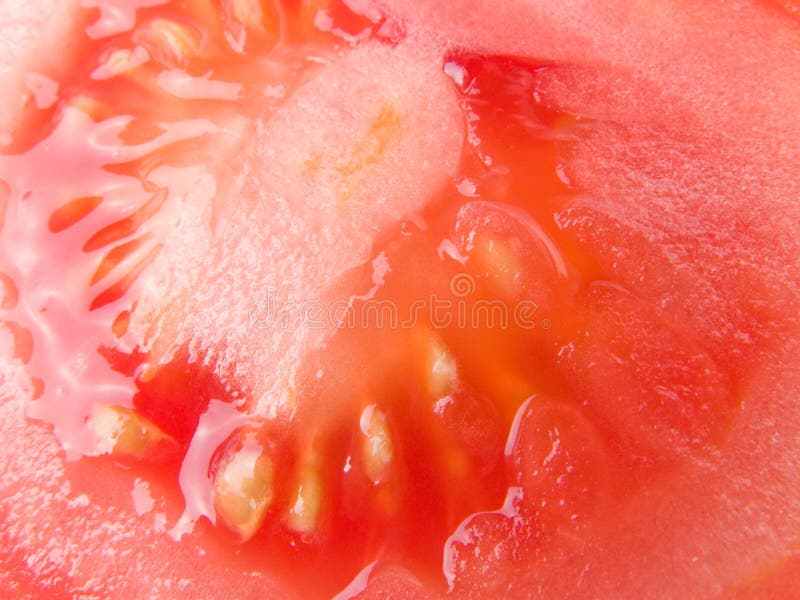 Schließen Sie oben vom Innenraum einer reifen Tomate lizenzfreies stockfoto Schließen Sie oben vom Innenraum einer reifen Tomate lizenzfreies stockfoto