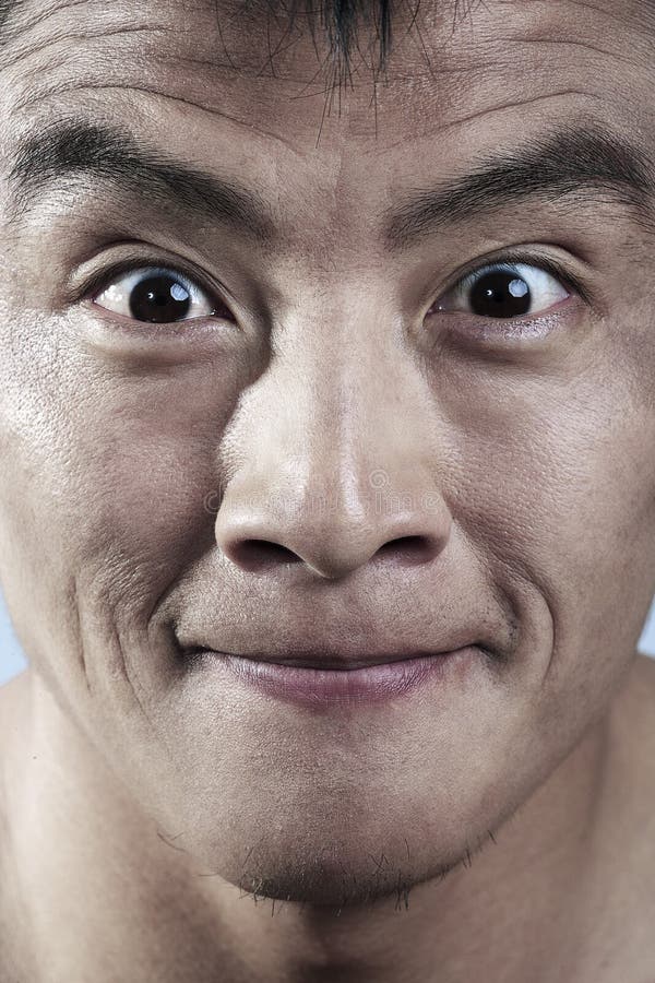 Schließen Sie oben von jungem bemannt das Gesichtslächeln stockfoto Schließen Sie oben von jungem bemannt das Gesichtslächeln stockfoto
