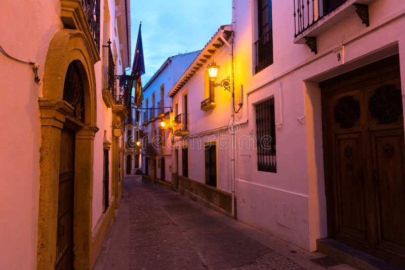 Narrow street in european city. Ronda, Spain. Narrow street in european city. Ronda, Spain