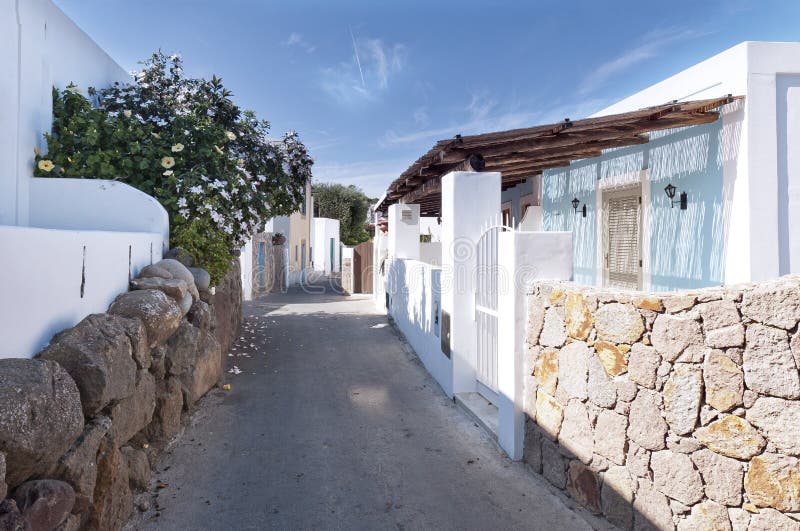 The narrow street with white buildings, the island of Panarea. The narrow street with white buildings, the island of Panarea