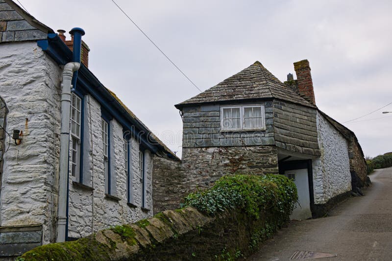 Narrow streets wend there way past cottages in Port Isaac. Port Isaac is a traditional fishing village in Cornwall. It is the setting for the to series Doc Martin. From the 14th to mid 19th centuries many items were brought in to,the post including coal Tim pottery and slate. After that time it just became a fishing village. Narrow streets wend there way past cottages in Port Isaac. Port Isaac is a traditional fishing village in Cornwall. It is the setting for the to series Doc Martin. From the 14th to mid 19th centuries many items were brought in to,the post including coal Tim pottery and slate. After that time it just became a fishing village.