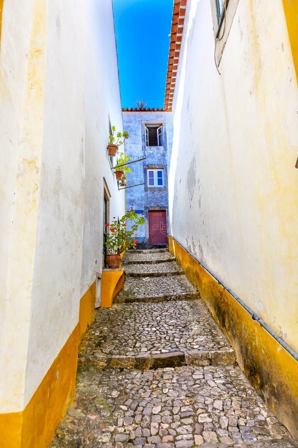 Narrow White Yellow Street 11th Century Medieval Town Obidos Portugal. Narrow White Yellow Street 11th Century Medieval Town Obidos Portugal.