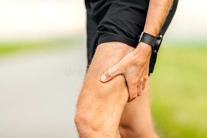 Runners leg and muscle pain on running training outdoors in summer nature, sport jogging physical injury when working out. Health and fitness concept with sore body. Runners leg and muscle pain on running training outdoors in summer nature, sport jogging physical injury when working out. Health and fitness concept with sore body