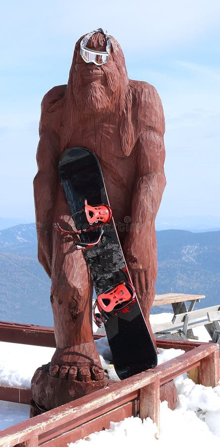 Snowman with snowboard at the ski resort. Snowman with snowboard at the ski resort