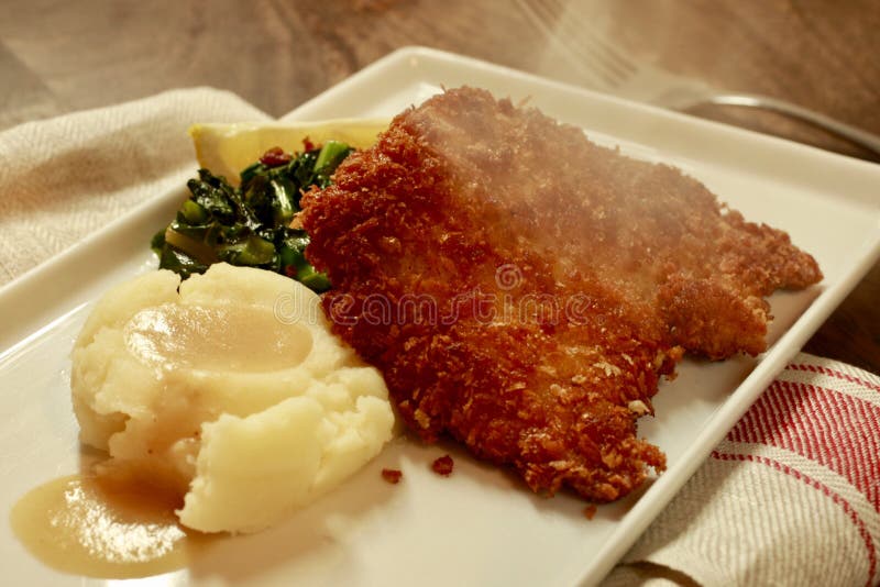 Schnitzel with Mashed Potatos on a white plate stock images Schnitzel with Mashed Potatos on a white plate stock images