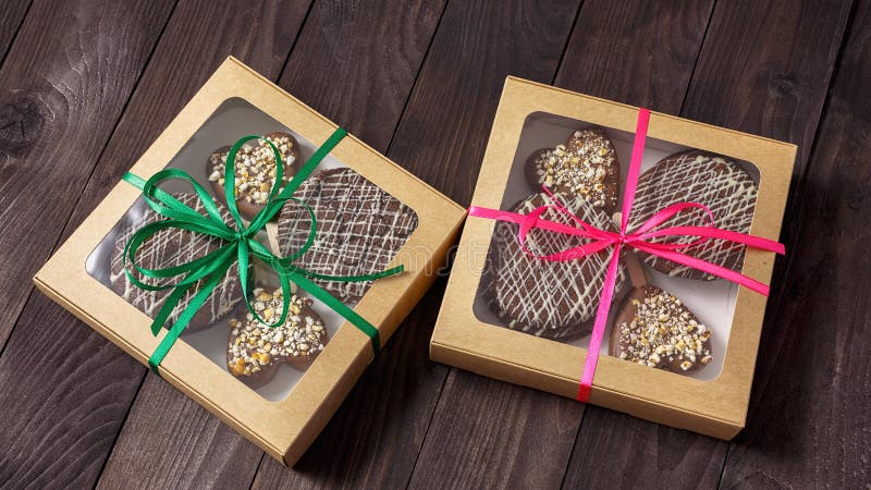 Chocolate dessert, cake in a box on a wooden background. Chocolate dessert, cake in a box on a wooden background