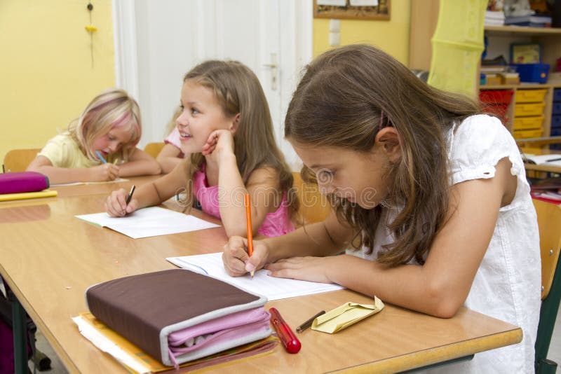 Children are learning in a yellow classroom. Children are learning in a yellow classroom