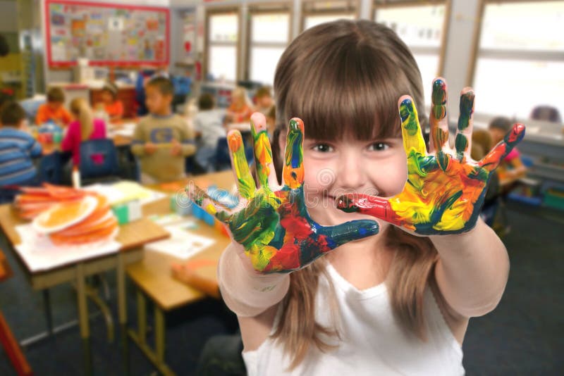School Age Child Painting With Her Hands in Class