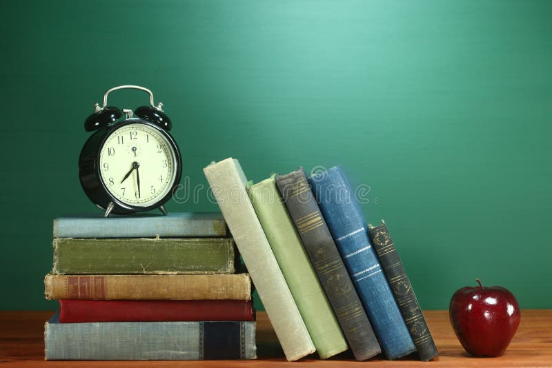 School Books, Apple and Clock on Desk at School Stock Image Image of