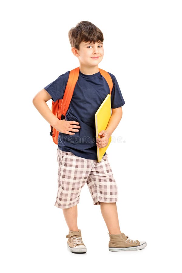 School boy with backpack holding a notebook royalty free stock image