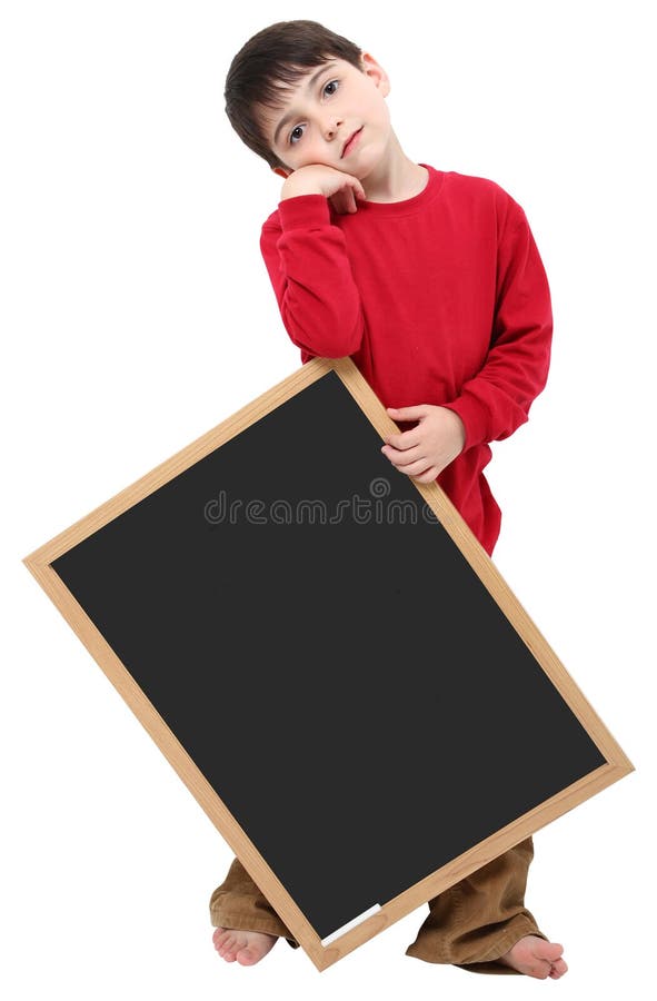 Adorable six year old school boy with blank chalkboard with clipping path over white. Boring kid white stock images, royalty-free photos and pictures