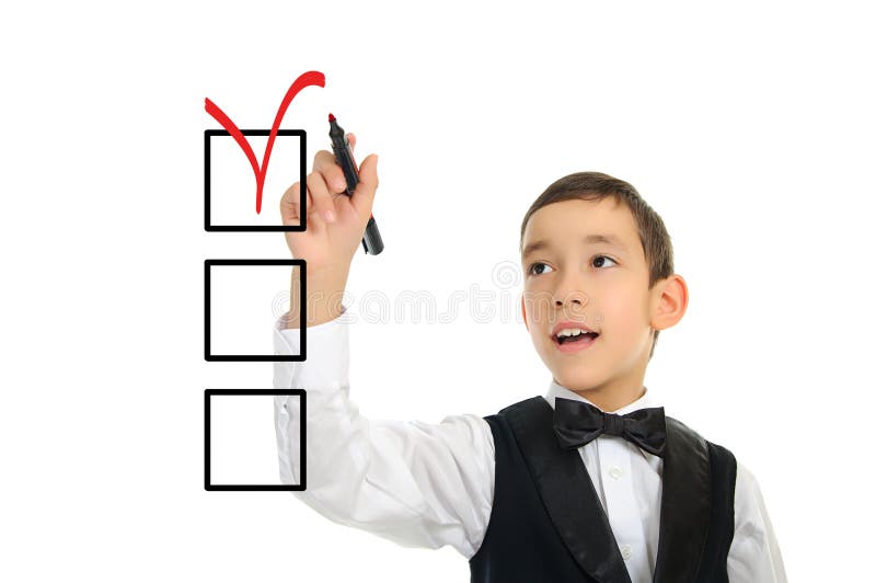 School boy wrighting checkboxes with pen