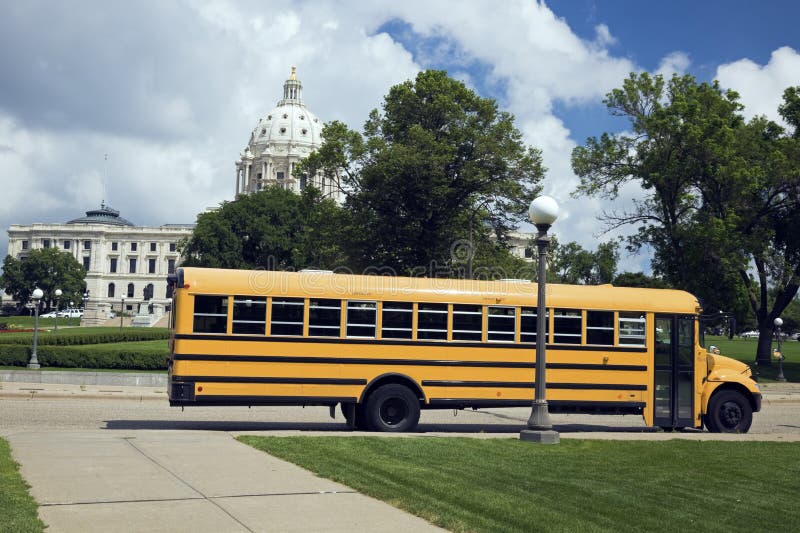 School Bus in front of State Capitol royalty free stock image School Bus in front of State Capitol royalty free stock image