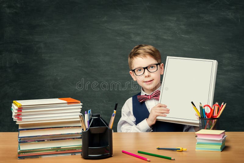School Child Advertising Book over Blackboard, Boy Student royalty free stock image School Child Advertising Book over Blackboard, Boy Student royalty free stock image