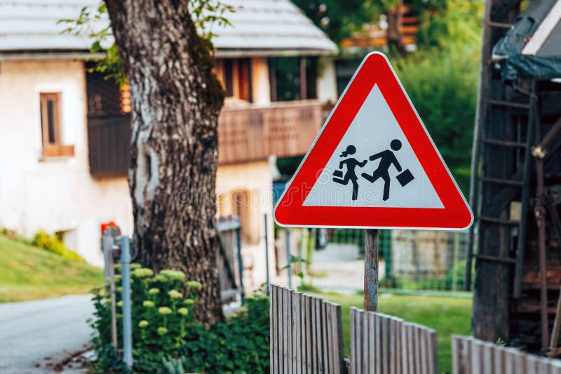 Children crossing road sign isolated Stock Photo - Alamy