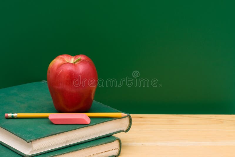 Apple Plus Stack of Books on a Desk for Back To School Stock Image ...