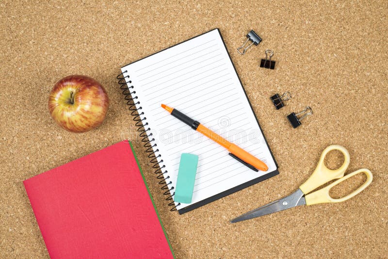 School elements on cork background with space for text symbolizing back to school. royalty free stock images School elements on cork background with space for text symbolizing back to school. royalty free stock images