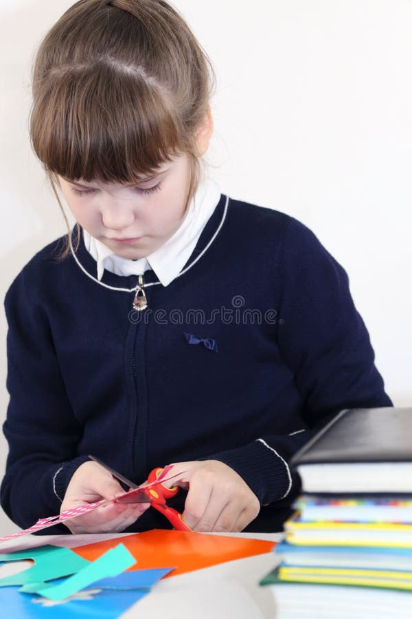 https://thumbs.dreamstime.com/b/school-girl-cuts-out-scissors-colored-paper-school-girl-cuts-out-scissors-colored-paper-table-books-103835906.jpg