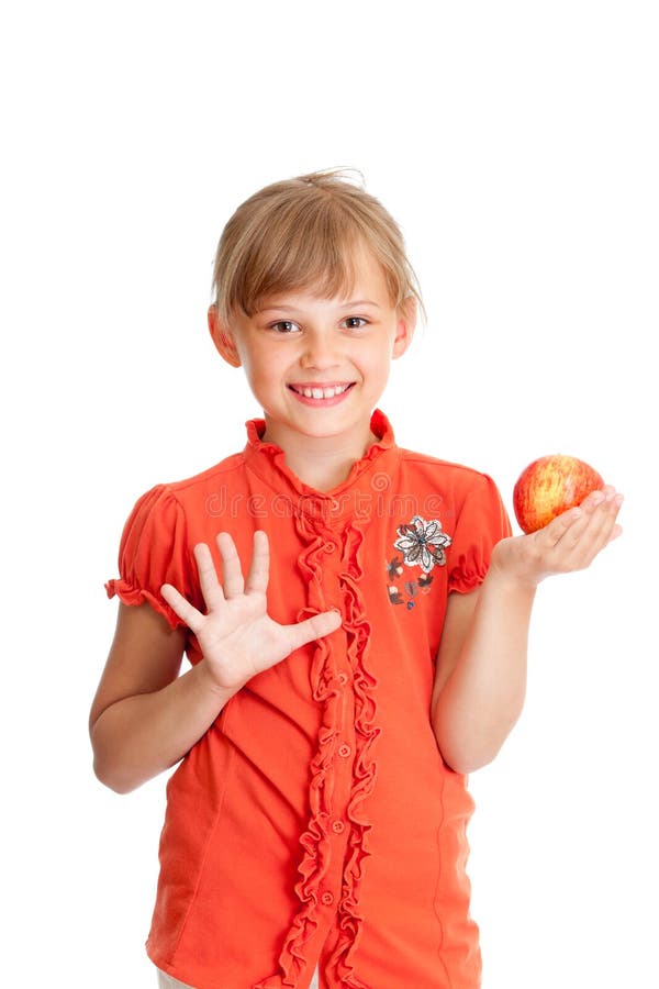 School girl portrait eating red apple isolated