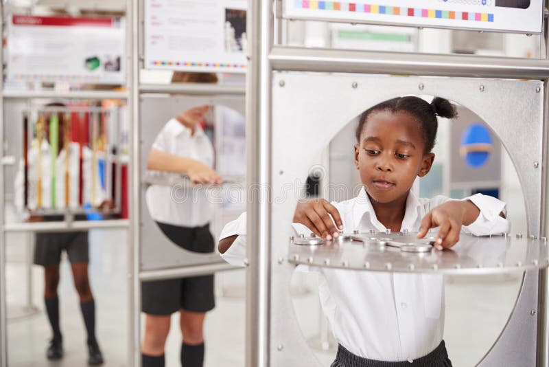 School Kids Taking Part in Science Tests at a Science Centre Stock