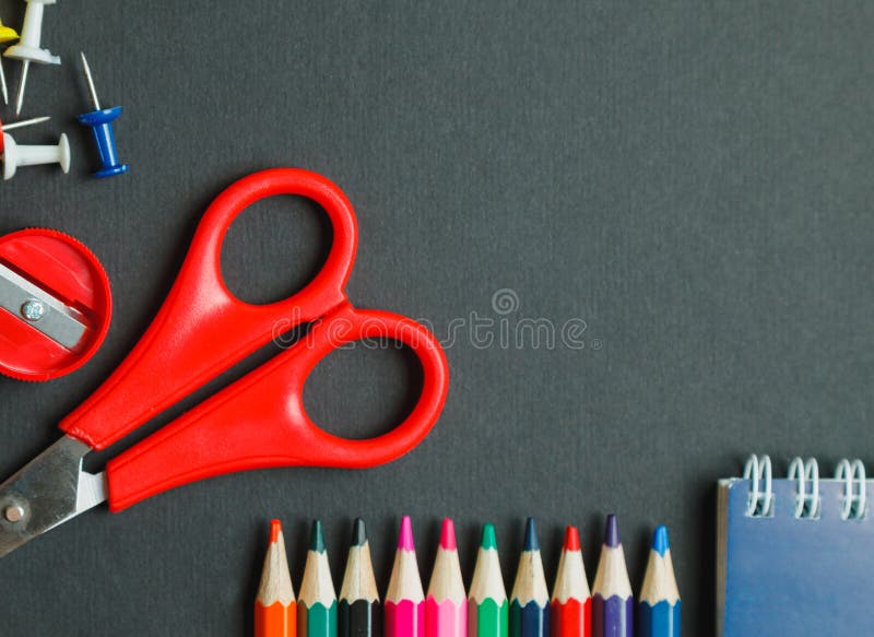 School and office supplies on dark background. Top view with copy space royalty free stock image School and office supplies on dark background. Top view with copy space royalty free stock image