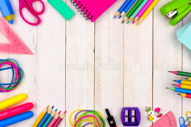 School supplies frame over a white wood background