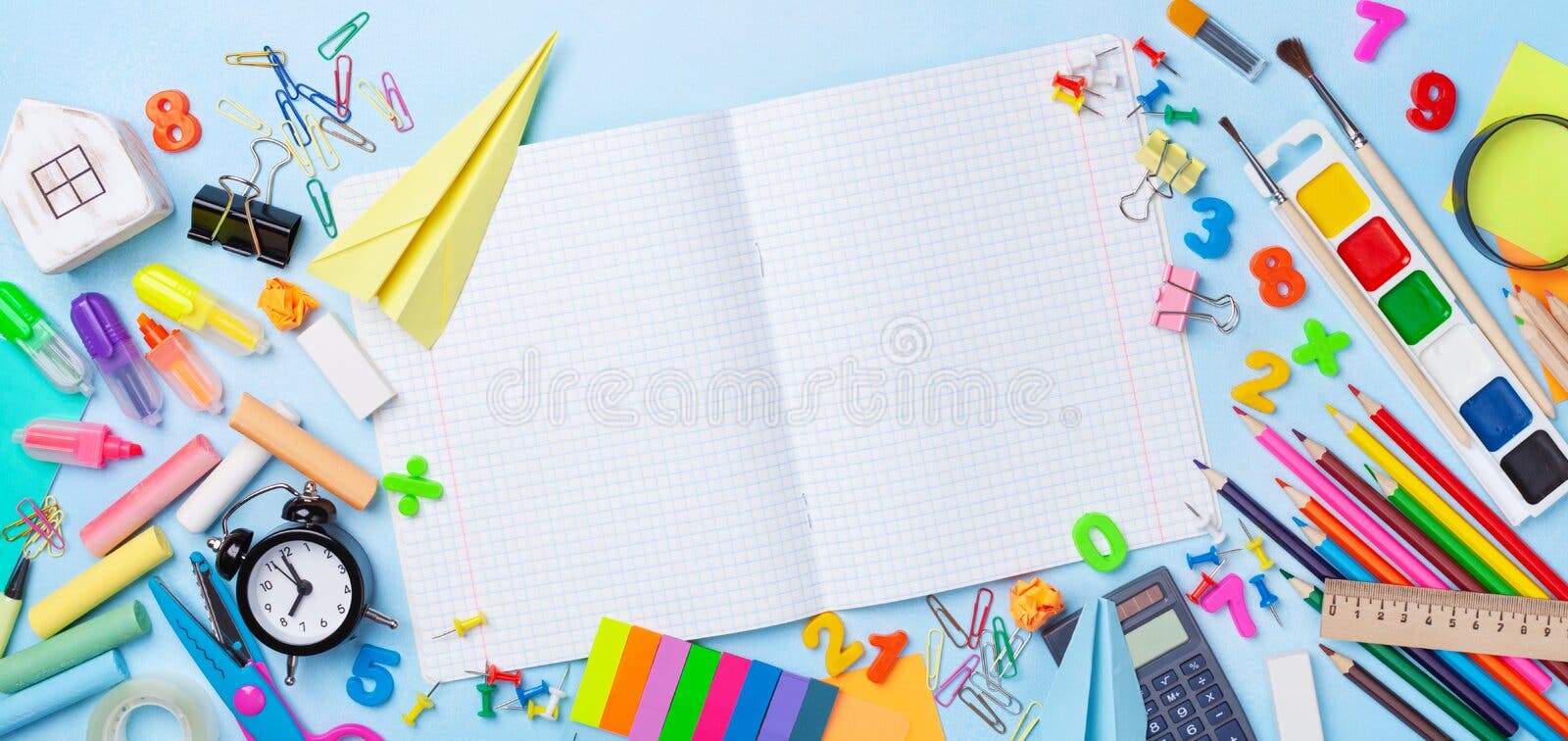School supplies and stationery with open notebook on blue table top view. Education, learning and back to school concept. stock photography School supplies and stationery with open notebook on blue table top view. Education, learning and back to school concept. stock photography