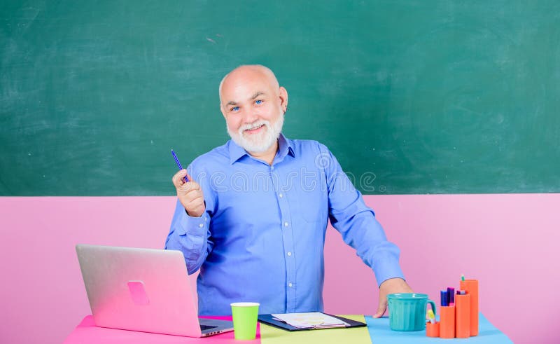 School teacher programming with laptop. Handsome man use modern technology. Digital technology. Online course for programmers. Programming web development. Teacher teaching programming language.