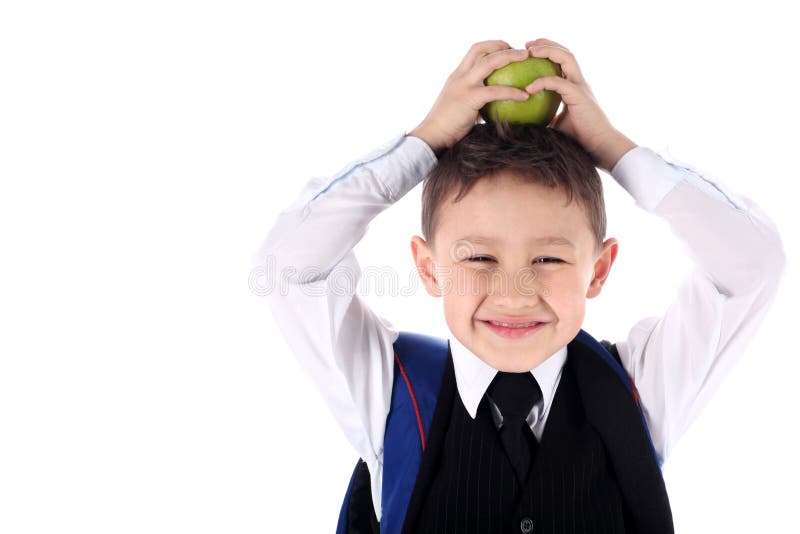 Schoolboy with backpack and apple