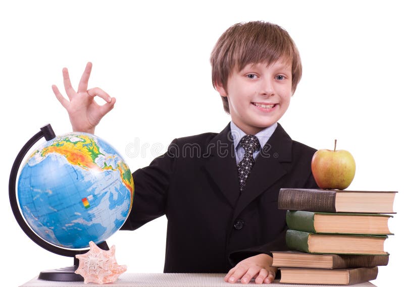 Schoolboy looks at a globe