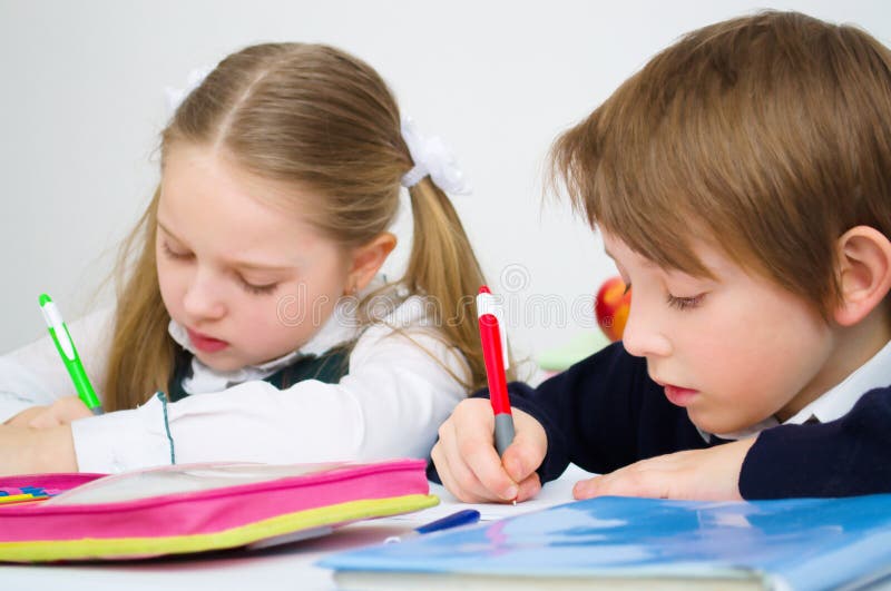 Schoolchildren writing in workbook