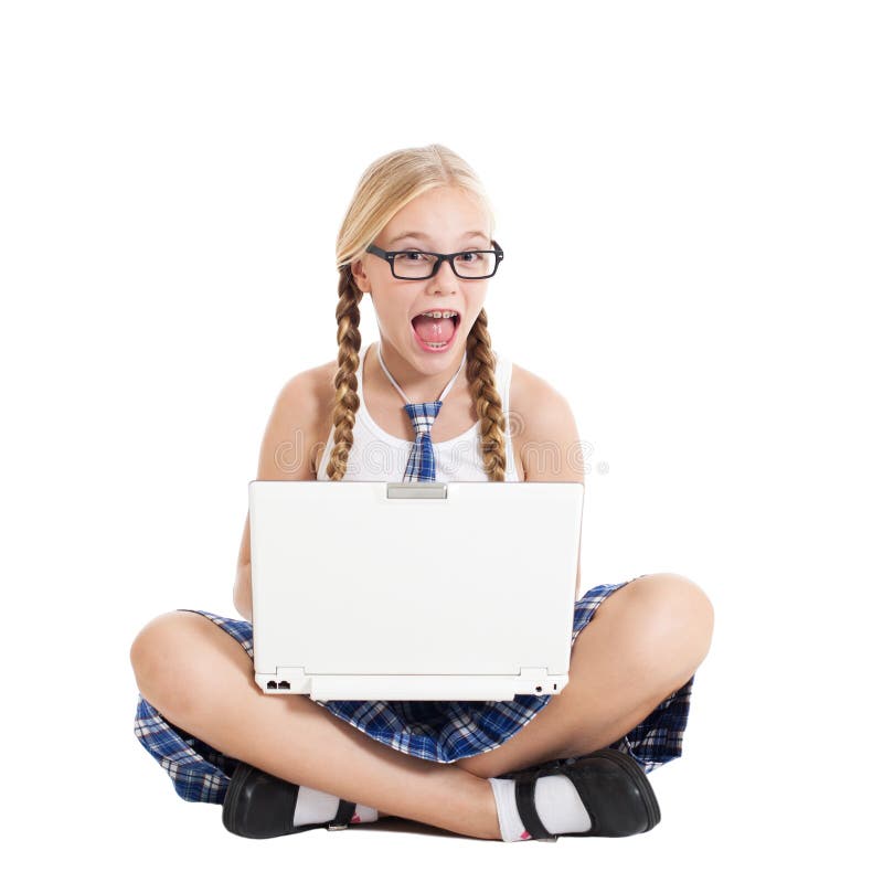 Schoolgirl wearing a school uniform sitting on the floor with a laptop on your lap