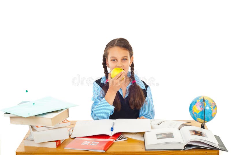 Schoolgirl eating apple royalty free stock images