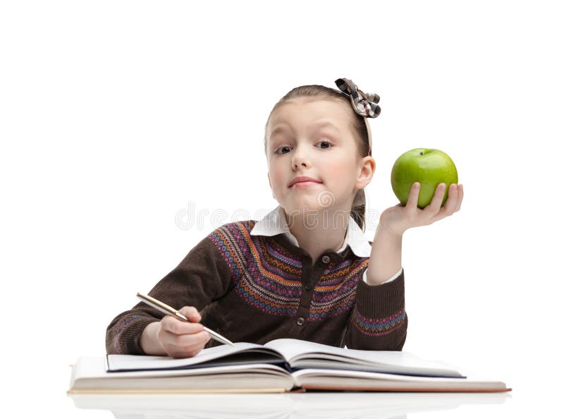 Schoolgirl with a green apple royalty free stock photo