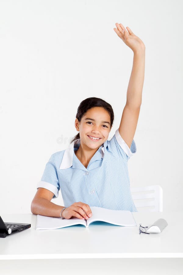 Schoolgirl hand up in classroom